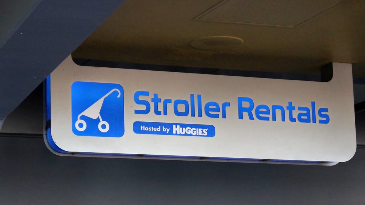 Disney World Stroller Rental: Cost, Rules, and Whether To... 5 stroller rentals disney world sign