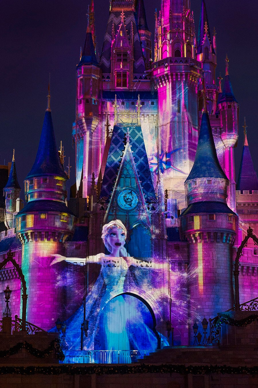 Best Places to Watch Magic Kingdom Fireworks at Disney World 11 Elsa projection on Cinderella Castle during a holiday projection show